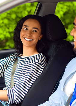 excited brunette woman sitting at driving car seat 2025 03 18 18 28 53 utc