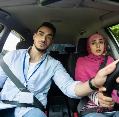 nervous muslim lady in hijab having driving lesson 2025 03 18 18 17 47 utc